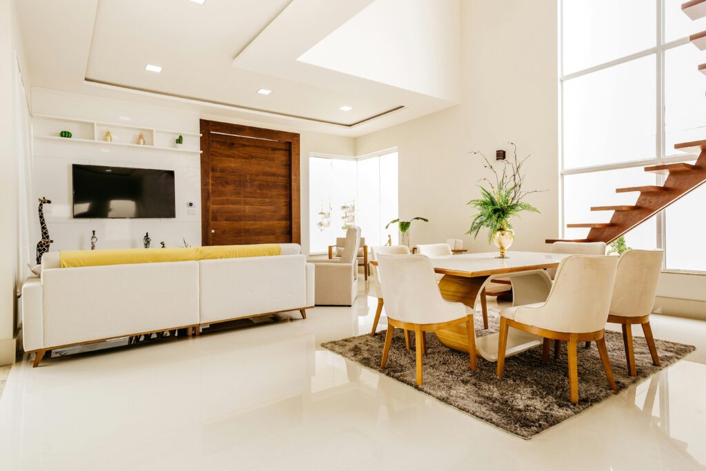 Modern interior of modern living room with second level space in minimalistic design in white color with wooden elements